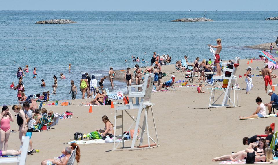 Swimmers enjoy Lake Erie off Beach 6 at Presque Isle State Park. While the lake's water levels remain above average, they are below record highs and are forecast to drop through the end of 2023.