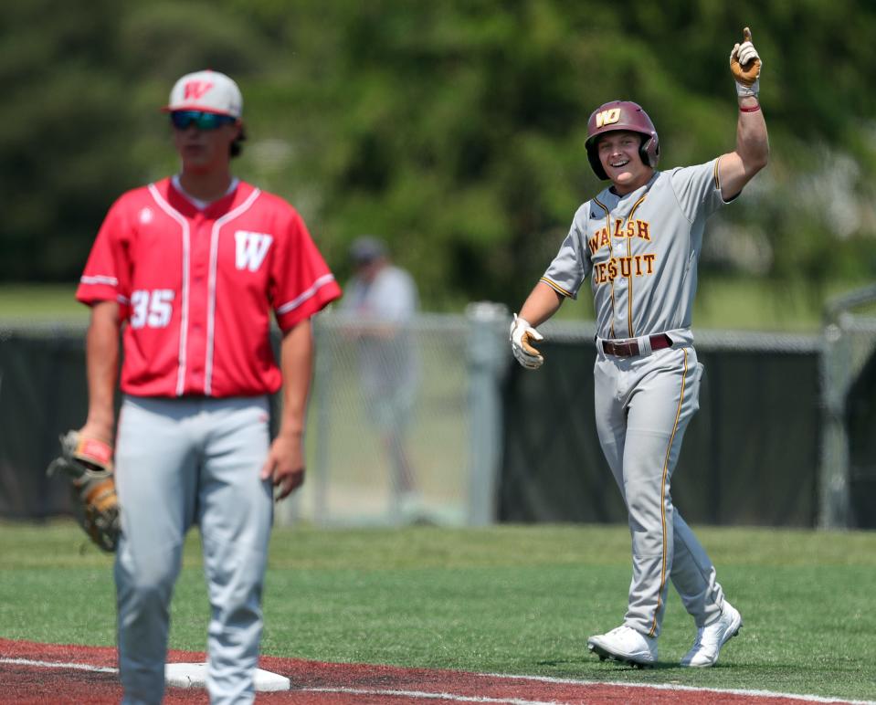 Walsh Jesuit batter Topher Salek celebrates after his single to load the bases against Wadsworth during the third inning of a Division I regional semifinal baseball game, Thursday, June 1, 2023, in Oberlin, Ohio.