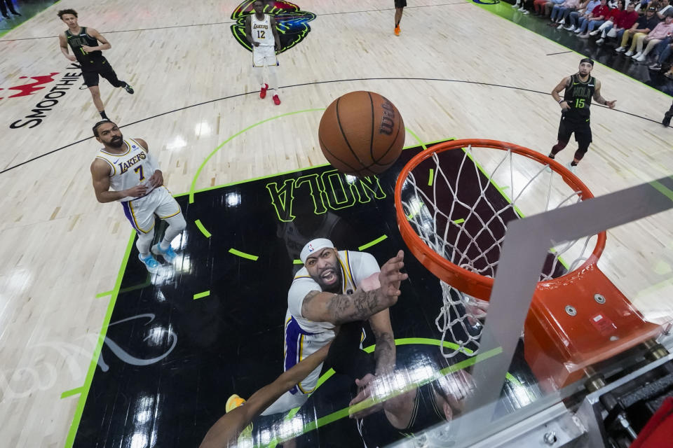 Los Angeles Lakers forward Anthony Davis goes to the basket in the second half of an NBA basketball game against the New Orleans Pelicans in New Orleans, Sunday, April 14, 2024. The Lakers won 124-108. (AP Photo/Gerald Herbert)