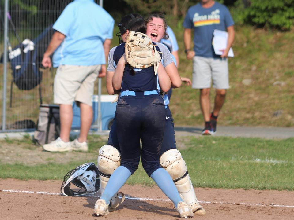 Triton catcher Skylar Colburn hugs pitcher Emma Penniman in celebration after defeating Dighton-Rehoboth in the MIAA Division III Round of Eight.