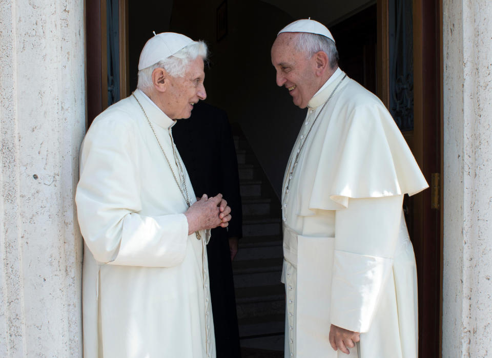FILE - Pope Francis, right, greets Pope Emeritus Benedict XVI at the Vatican on June 30, 2015. Pope Emeritus Benedict XVI, the German theologian who will be remembered as the first pope in 600 years to resign, has died, the Vatican announced Saturday. He was 95. (L'Osservatore Romano/Pool Photo via AP, File)