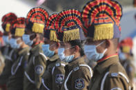 Police officials wearing face masks as precautions against COVID-19 participate in India's Republic Day celebrations in Ahmedabad, India, Tuesday, Jan. 26, 2021. Republic Day marks the anniversary of the adoption of the country's constitution on Jan. 26, 1950. (AP Photo/Ajit Solanki)