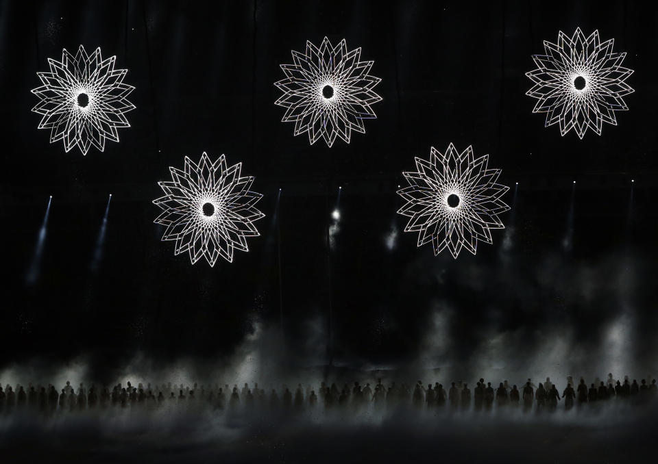 Geometric figures are readied to be opened into the Olympic rings as performers sing during the Opening Ceremony of the Sochi Winter Olympics at the Fisht Olympic Stadium on February 7, 2014 in Sochi. 