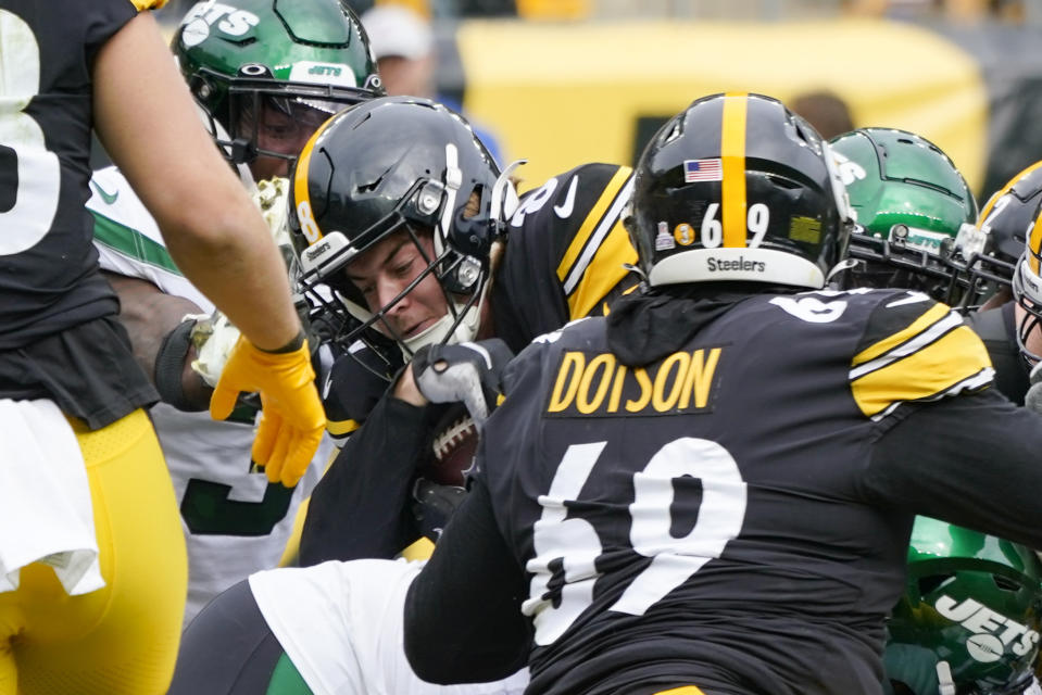 Pittsburgh Steelers quarterback Kenny Pickett, center, gets into the end zone for a touchdown against the New York Jets during the second half of an NFL football game, Sunday, Oct. 2, 2022, in Pittsburgh. (AP Photo/Gene J. Puskar)
