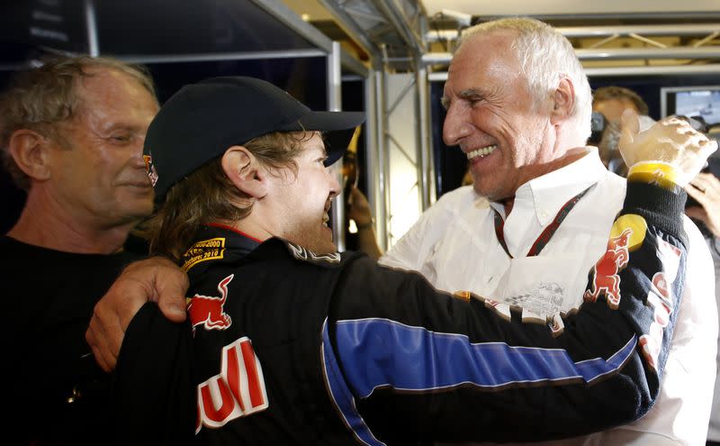 Red Bull owner Mateschitz congratulates Red Bull Formula One driver Vettel for winning championship and Abu Dhabi Grand Prix at Yas Marina circuit