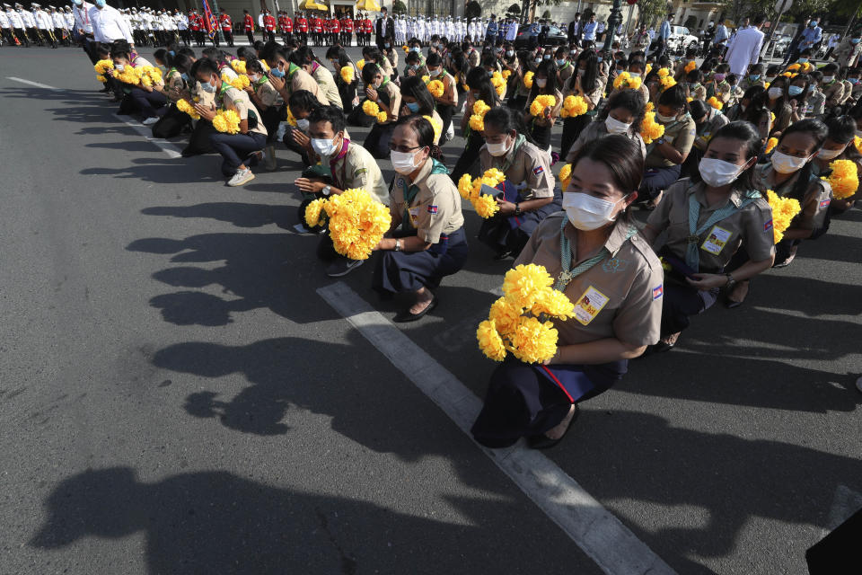 Cambodia students participate in the country's 67th Independence Day celebration, in Phnom Penh, Cambodia, Monday, Nov. 9, 2020. (AP Photo/Heng Sinith)