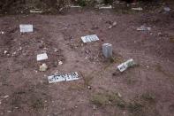 Graves of migrants who drowned at sea during an attempt to cross a part of the Aegean Sea from the Turkish coast, are seen at the Saint Panteleimon cemetery of Mytilene, on the Greek island of Lesbos, October 7, 2015. REUTERS/Dimitris Michalakis