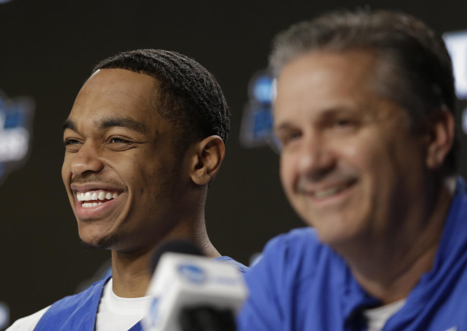 Kentucky's PJ Washington, left, smiles alongside head coach John Calipari during a news conference at the NCAA tournament college basketball tournament Saturday, March 30, 2019, in Kansas City, Mo. Kentucky is set to play Auburn in the Midwest regional final on Sunday. (AP Photo/Jeff Roberson)