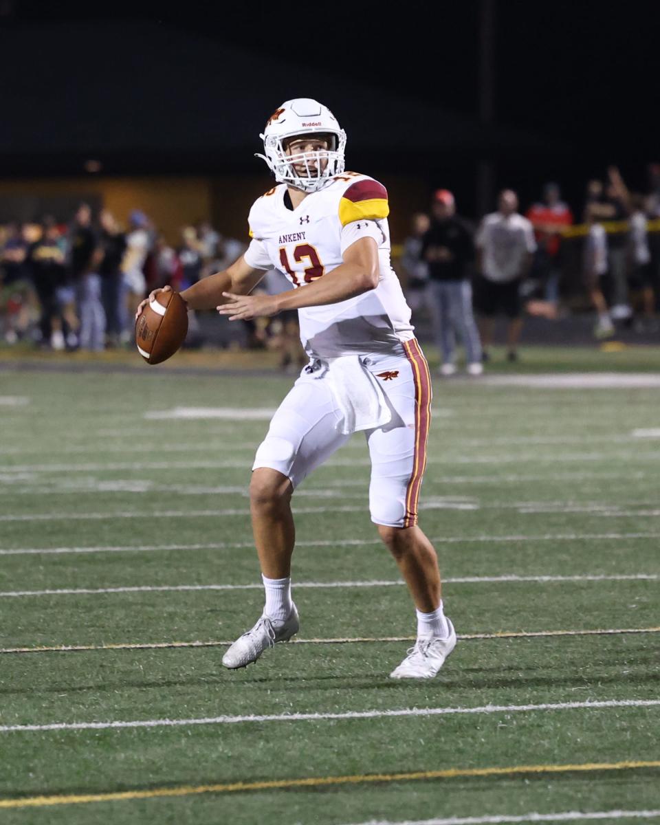 Ankeny's JJ Kohl (12) throws a pass against Southeast Polk. Kohl threw four touchdowns against the Rams.