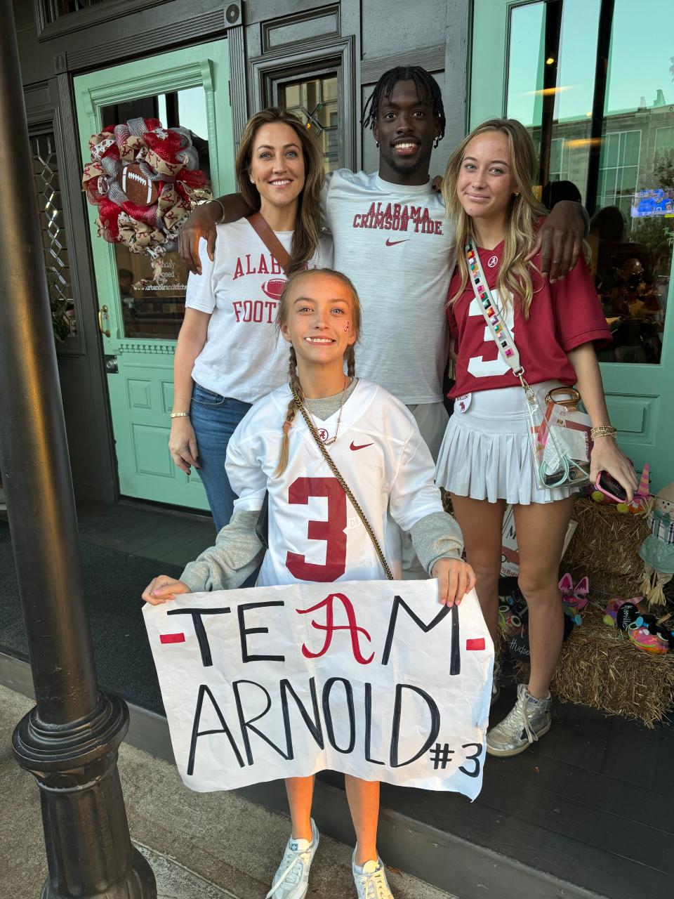 New Detroit Lions cornerback Terrion Arnold poses with Sara Bayliss, left, and her daughters Blair, right, and Blakely, after an Alabama football game.
