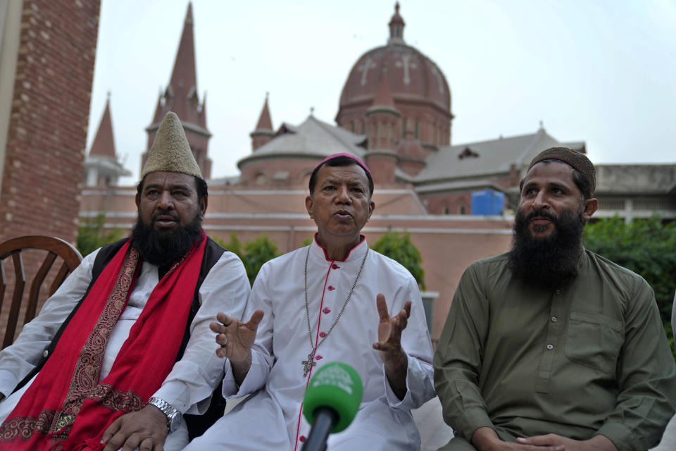Archbishop Sebastian Francis Shaw, center, and Muslim clerics Maulana Muhammad Asim Makhdoom, right, and Mufti Syed Ashiq Hussain give a press conference regarding Jaranwala's Muslim mob attack and burnt churches, at the Sacred Heart Cathedral in Lahore, Pakistan, Wednesday, Aug. 16, 2023. A Muslim mob went on a rampage Wednesday, attacking a Christian area in eastern Pakistan, burning a church and damaging two others, police said. The attackers also demolished a man's house after accusing him of desecrating Islam's holy book and attacked several other Christian homes. (AP Photo/K.M. Chaudary)
