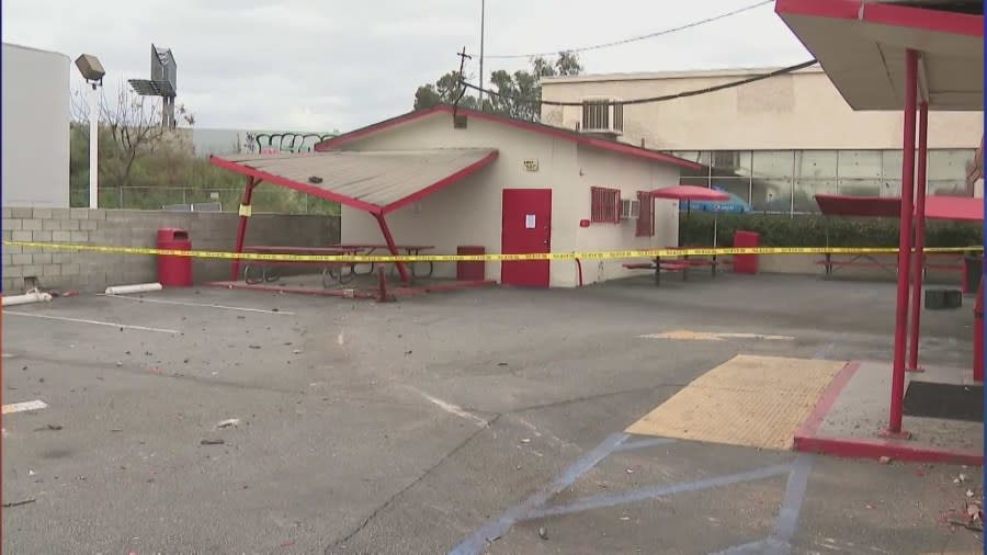 A second structure in the back was also damaged after a DUI driver crashed into a police car, sending it crashing in Art's Burgers in El Monte on April 11, 2024. (KTLA)