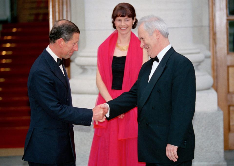 Bruton, together with his wife Finola, welcomes Prince Charles to a state banquet at Dublin Castle in 1995