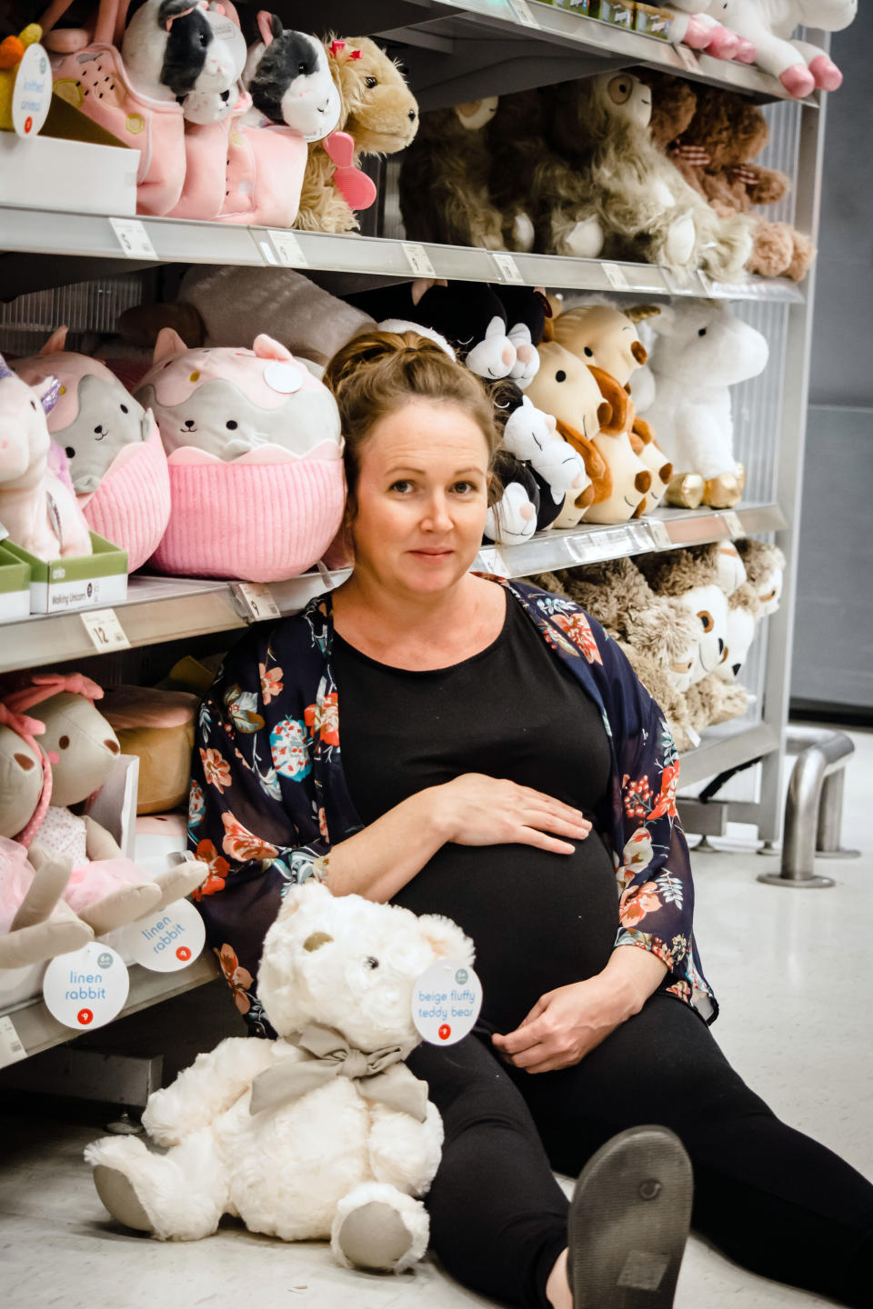 Bargain-obsessed mum, Kirby Northey, has posed for a hilarious maternity photoshoot in Kmart. Photo: Caters News