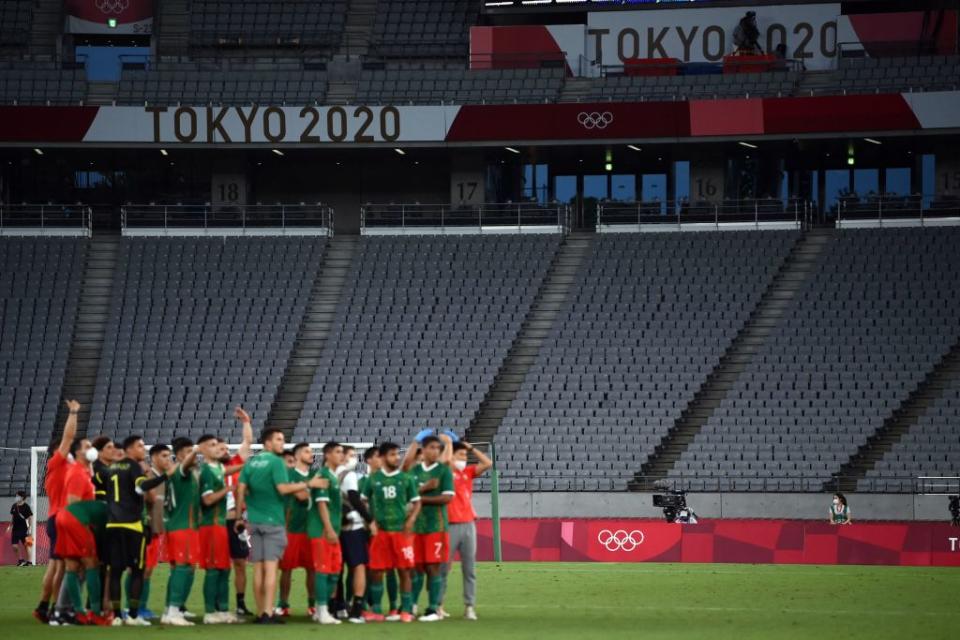 Mexico team celebrate their victory at the end of the Tokyo 2020 Olympic Games men's group A first round football match between Mexico and France at Tokyo Stadium in Tokyo on July 22, 2021.<span class="copyright">Franck Fife—AFP/Getty Images</span>