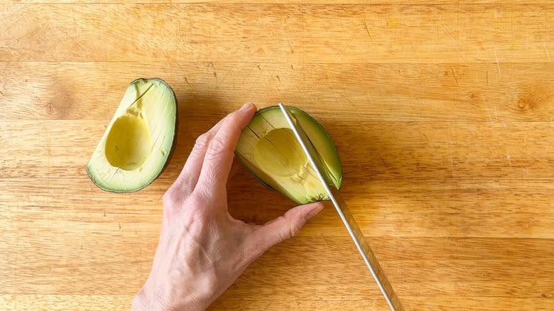 knife slicing avocados