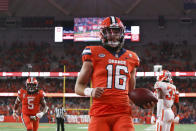 Syracuse quarterback Garrett Shrader (16) scores a touchdown during the second quarter of the team's NCAA football game against Clemson in Syracuse, N.Y., Friday, Oct. 15, 2021. (AP Photo/Joshua Bessex)