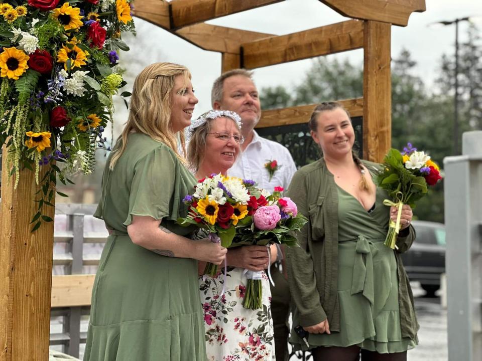 From left to right: Jacci Morse, Debbie and Ed Topczewski and Bobi Dushnick during the Canisteo Crazee Daze parade wedding on the BK's Boutique & Florist float June 8.