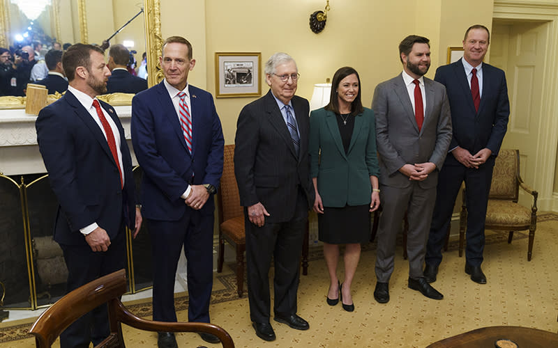 Sens.-elect Markwayne Mullin (R-Okla.), Ted Budd (R-N.C.), Katie Britt (R-Ala.), J.D. Vance (R-Ohio) and Eric Schmitt (R-Mo.) pose for a photo