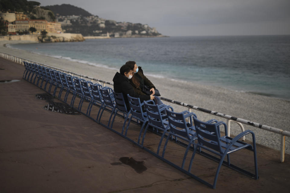 FILE - In this Saturday, Feb. 27, 2021 filer, people enjoy the view at the Promenade des Anglais in Nice, southern France. Europe recorded 1 million new COVID-19 cases last week, an increase of 9% from the previous week and ending a six-week decline, WHO said Thursday, March 4, 2021. The so-called UK variant is of greatest concern in the 53 countries monitored by WHO in Europe. (AP Photo/Daniel Cole, File)