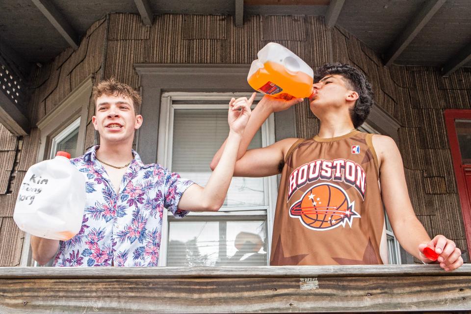 Delaware junior Jason Vera, 21, drinks from a BORG at a house party in Newark on Saturday, May 20, 2023.