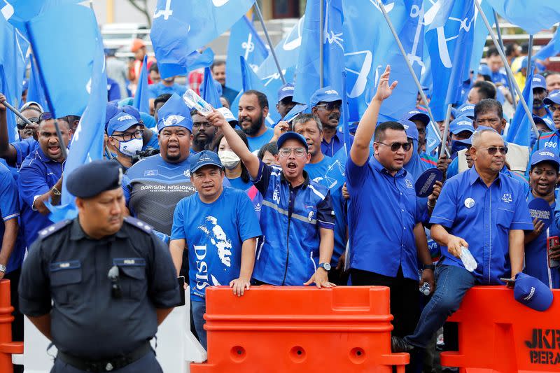 The supporters of The National Front coalition, Barisan Nasional, shout slogans outside a nomination centre on nomination day in Bera