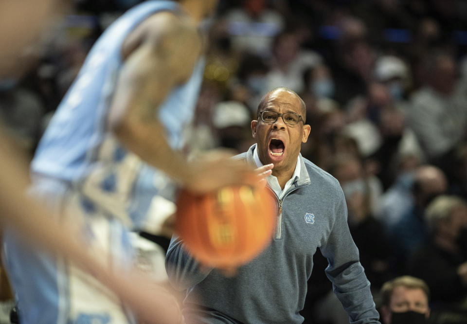 North Carolina head coach Hubert Davis directs his team in the first half of an NCAA college basketball game Saturday, Jan. 22, 2022, in Winston-Salem, N.C. (Allison Lee Isley/The Winston-Salem Journal via AP)