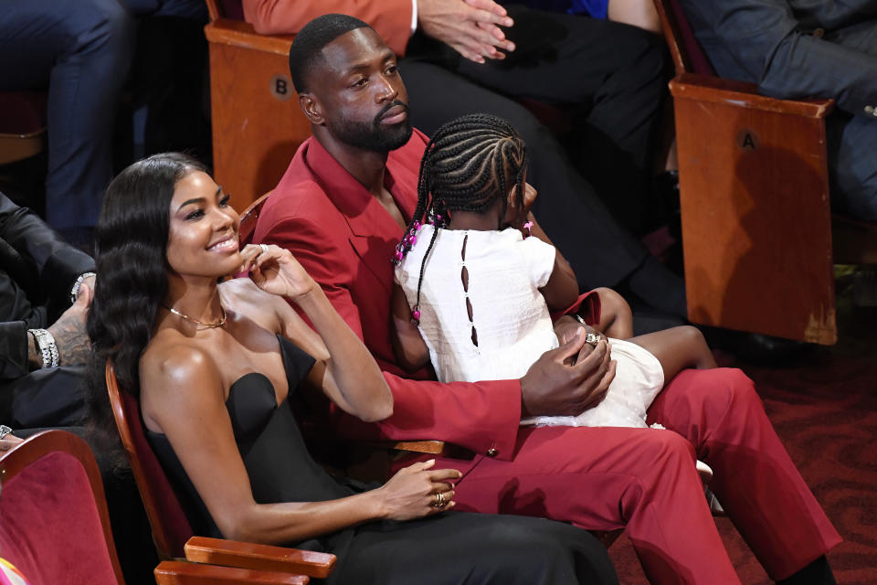 Dwyane Wade and wife Gabrielle Union listen to Pau Gasol during the Basketball Hall of Fame induction ceremony Saturday, Aug. 12, 2023, in Springfield, Mass. (AP Photo/Jessica Hill)