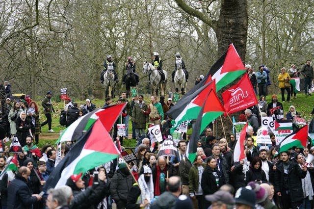 Mounted police officers watch protest