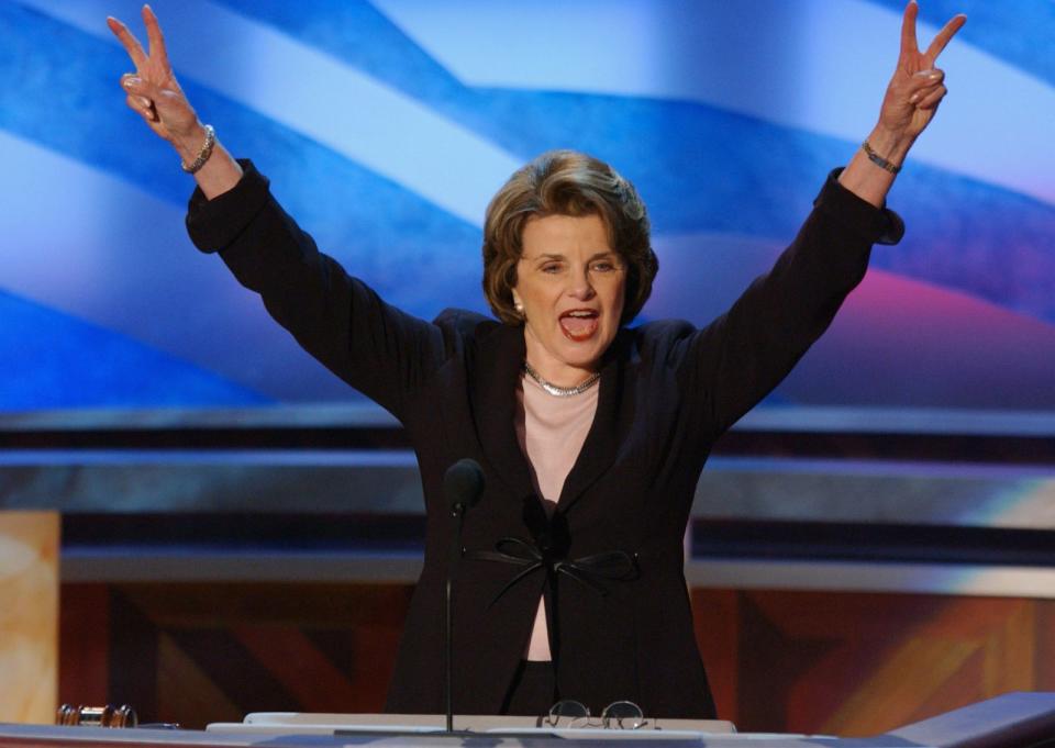 PHOTO: Senator Dianne Feinstein (D-CA) raises victory 'V's' after officially nominating Senator John F. Kerry for the presidency during the third session of the Democratic National Convention in Boston, July 28, 2004. (Emile Wamsteker/Bloomberg via Getty Images, FILE)