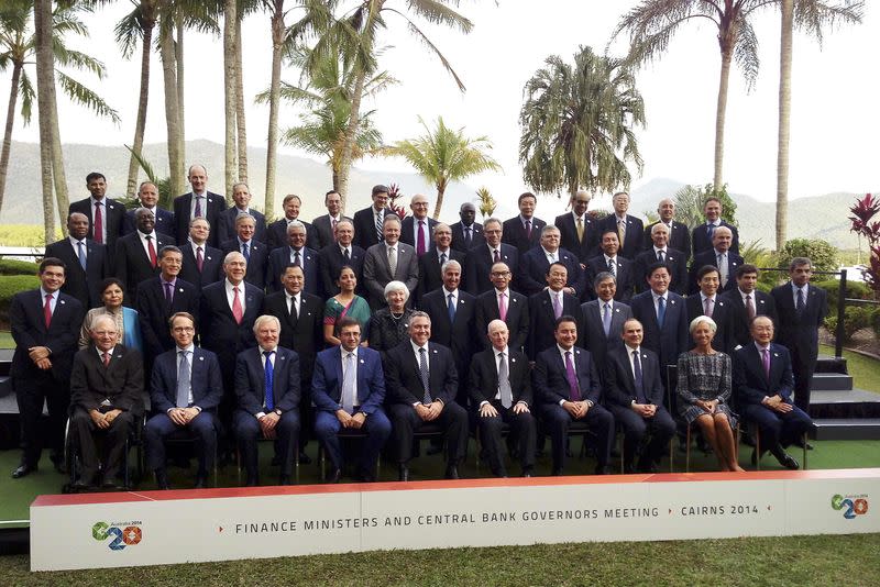 Delegates of the G20 Finance Ministers and Central Bank Governors Meeting pose together during an official photograph in the northern Australian city of Cairns September 20, 2014. REUTERS/Lincoln Feast/Files