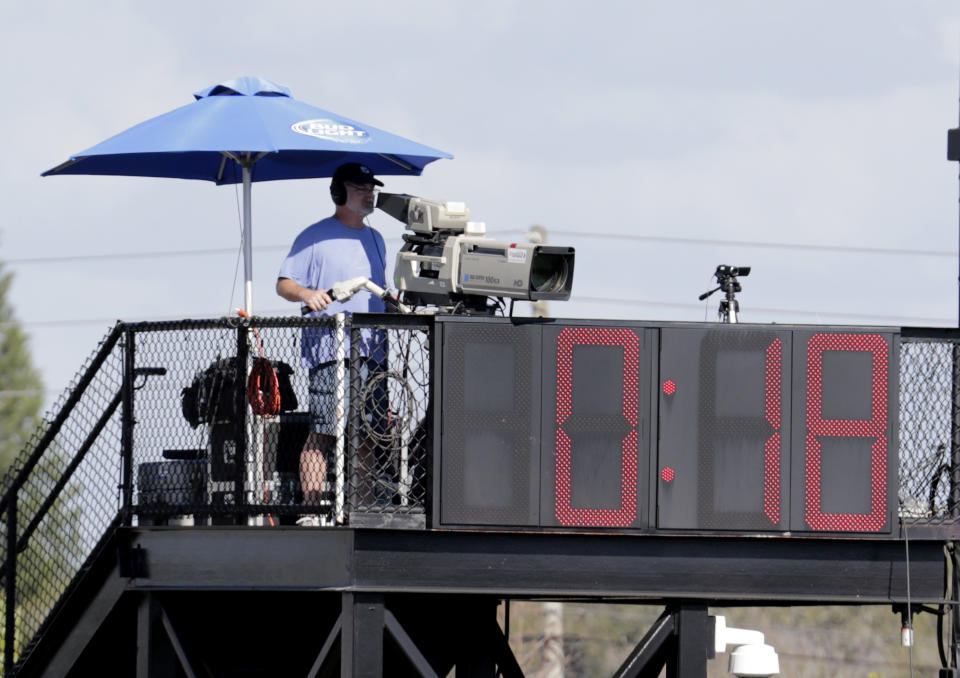The pitch clock runs during a spring training baseball game between the Philadelphia Phillies and Pittsburgh Pirates, Saturday, Feb. 23, 2019, in Clearwater, Fla. (AP Photo/Lynne Sladky)