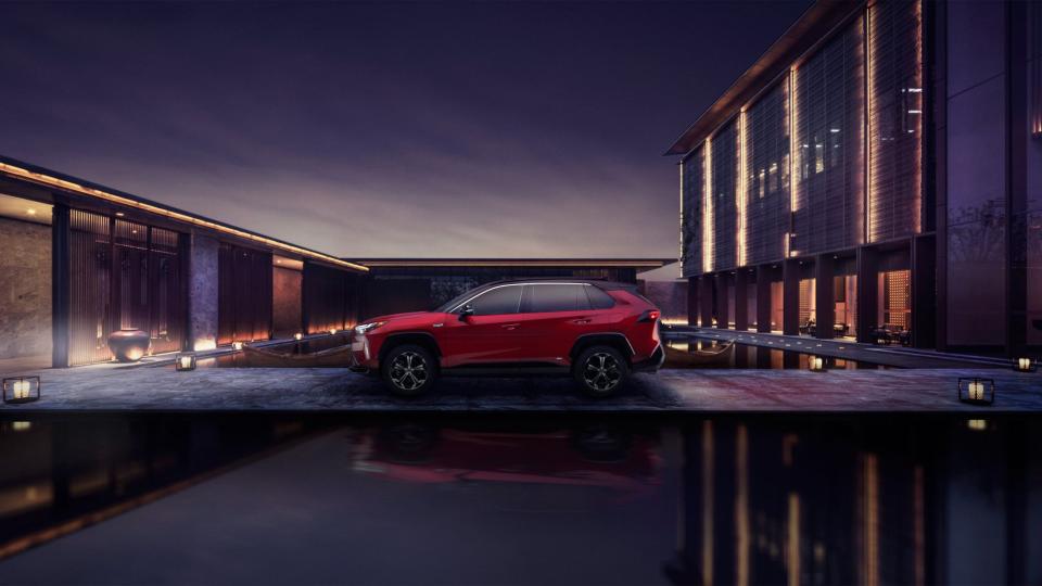 2024 Toyota RAV4 Prime parked outside building.