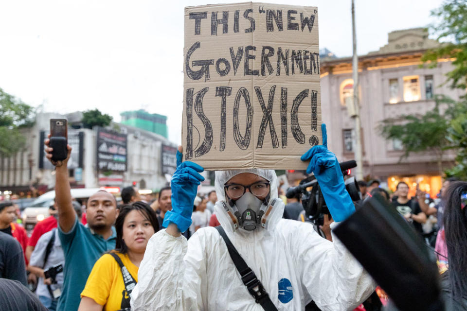 Demonstrators hold placards during a protest against Malaysia's newly sworn in prime minister, Muhyiddin Yassin in Kuala Lumpur on March 1, 2020. | Chris Jung—NurPhoto/Getty Images