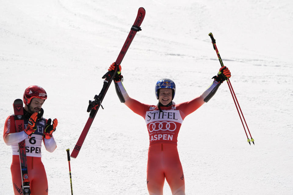 Switzerland's Marco Odermatt celebrates his victory in a men's World Cup giant slalom skiing race, Saturday, March 2, 2024, in Aspen, Colo. Teammate Loic Meillard, left, finished second. (AP Photo/Robert F. Bukaty)