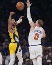 Indiana Pacers' Tyrese Haliburton (0) passes away from New York Knicks' Donte DiVincenzo during the first half of Game 1 in an NBA basketball second-round playoff series, Monday, May 6, 2024, in New York. (AP Photo/Frank Franklin II)