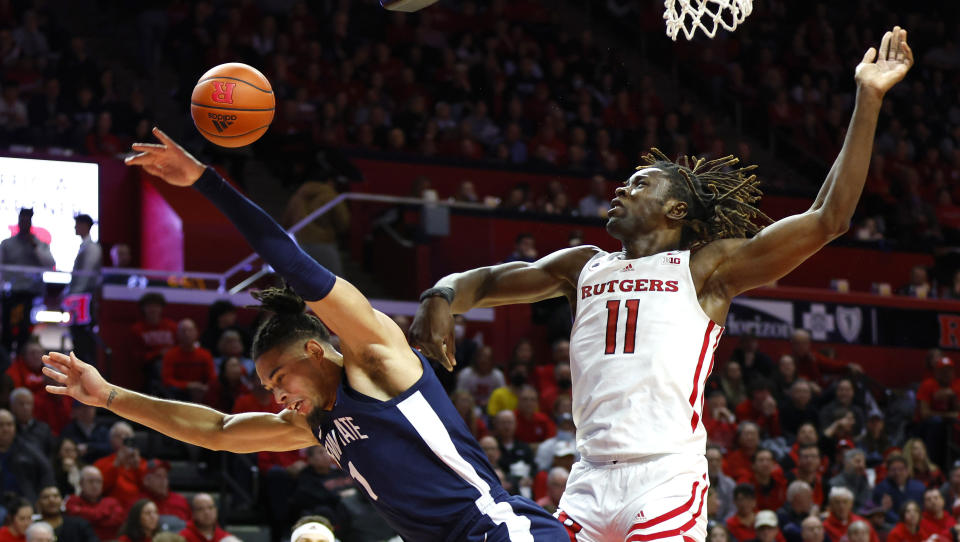 Rutgers center Clifford Omoruyi (11) blocks the shot of Penn State guard Seth Lundy (1) during the first half of an NCAA college basketball game in Piscataway, N.J. Tuesday, Jan. 24, 2023. (AP Photo/Noah K. Murray)