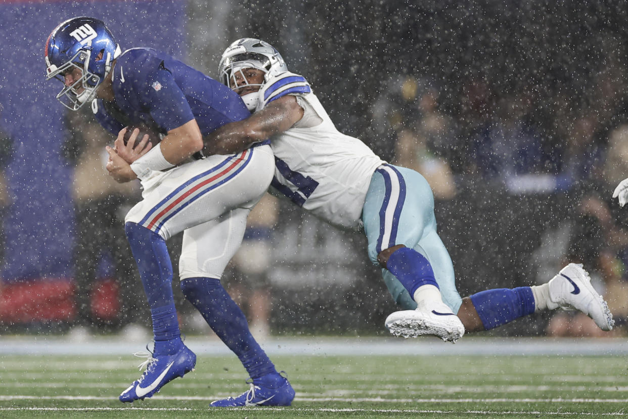Cowboys pass rusher Micah Parsons, right, sacks Giants quarterback Daniel Jones during the second half of Dallas' 40-0 victory. (AP Photo/Adam Hunger)