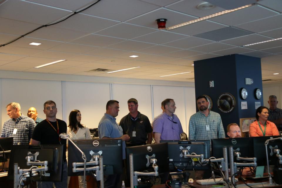 DSS Deputy Assistant Director Thad Osterhout (far left) and other DSS leadership, alongside interagency partners, closely monitored the departure from Khartoum from the DSS Command Center in Arlington, VA on April 22, 2023.