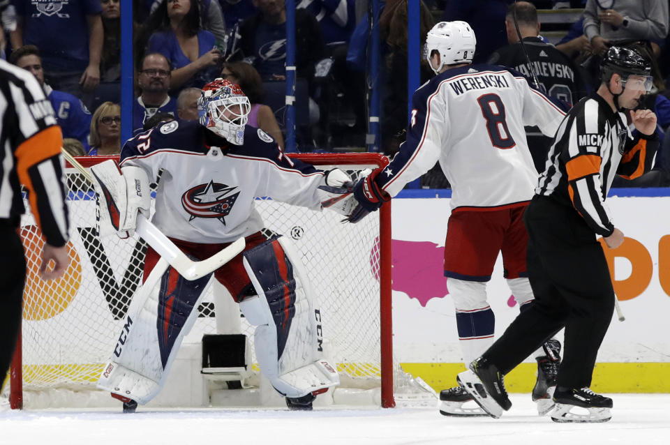 Columbus Blue Jackets goaltender Sergei Bobrovsky (72) celebrates with defenseman Zach Werenski (8) after the Blue Jackets defeated the Tampa Bay Lightning 4-3 during Game 1 of an NHL Eastern Conference first-round hockey playoff series Wednesday, April 10, 2019, in Tampa, Fla. (AP Photo/Chris O'Meara)