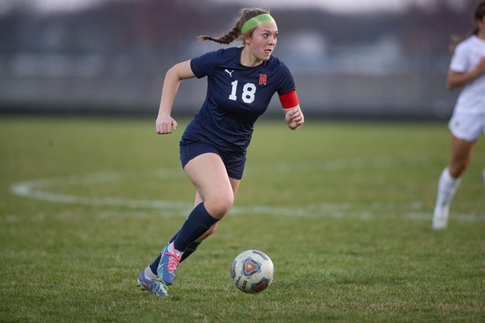 Belvidere North's Cortlyn Hefty takes the ball down the field against Boylan on Tuesday, April 11, 2023, at Belvidere North High School.