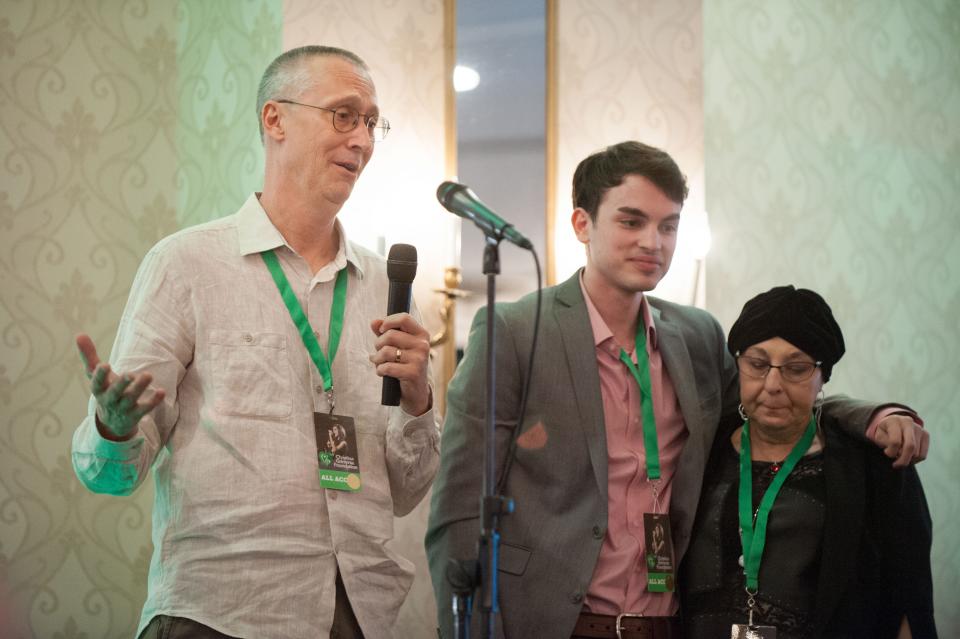 Christina Grimmie's father Bud (left) and mother Tina (right) and friend Pete Innaurato at a charity kickoff in 2018.