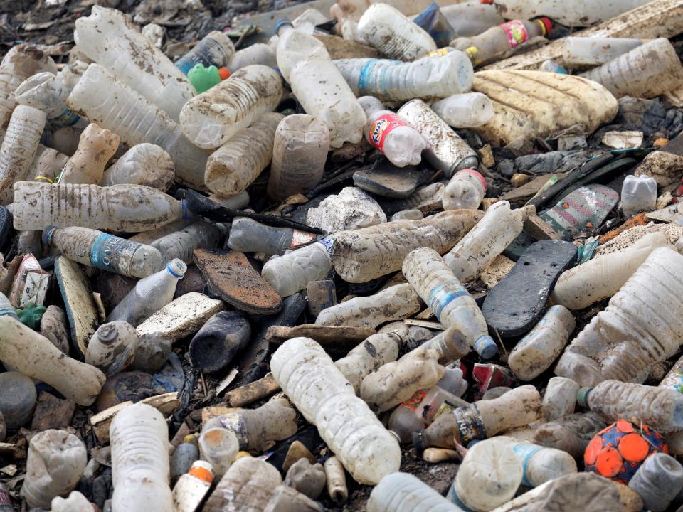 Plastic bottles and other waste are seen in a drain in West Africa