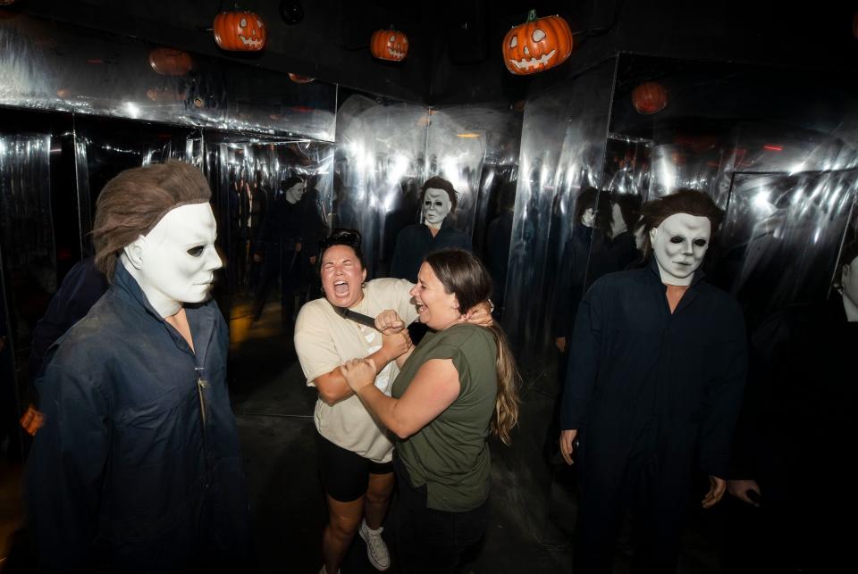 “Halloween,” featuring a scare actor dressed as a masked Michael Myers, is one of the 10 themed haunted houses at Universal Orlando Resort's Halloween Horror Nights event.