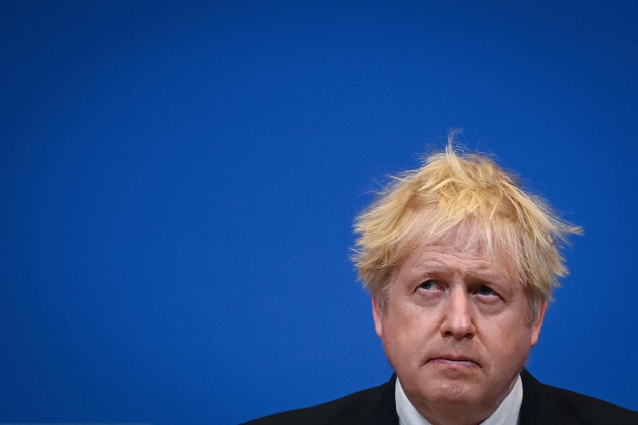 TOPSHOT - Britain's Prime Minister Boris Johnson reacts during a joint press conference with NATO Secretary General Jens Stoltenberg (unseen) following a meeting at the NATO headquartes in Brussels, on February 10, 2022. (Photo by Daniel LEAL / POOL / AFP) (Photo by DANIEL LEAL/POOL/AFP via Getty Images)
