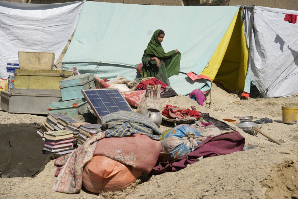 Afghans walks through a camp after an earthquake in Gayan district in Paktika province, Afghanistan, Sunday, June 26, 2022. A powerful earthquake struck a rugged, mountainous region of eastern Afghanistan early Wednesday, flattening stone and mud-brick homes in the country's deadliest quake in two decades, the state-run news agency reported. (AP Photo/Ebrahim Nooroozi)