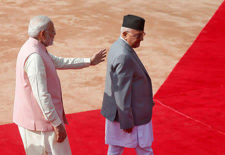 Nepal's Prime Minister Khadga Prasad Sharma Oli (R) and his Indian counterpart Narendra Modi walk during Oli's ceremonial reception at the forecourt of India's Rashtrapati Bhavan presidential palace in New Delhi, India, April 7, 2018. REUTERS/Altaf Hussain