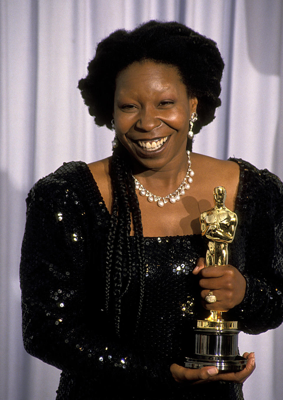 Whoopi Goldberg, with her Oscar for best supporting actress, at the 63rd Annual Academy Awards on March 25, 1991. / Credit: Ron Galella/Ron Galella Collection via Getty Images