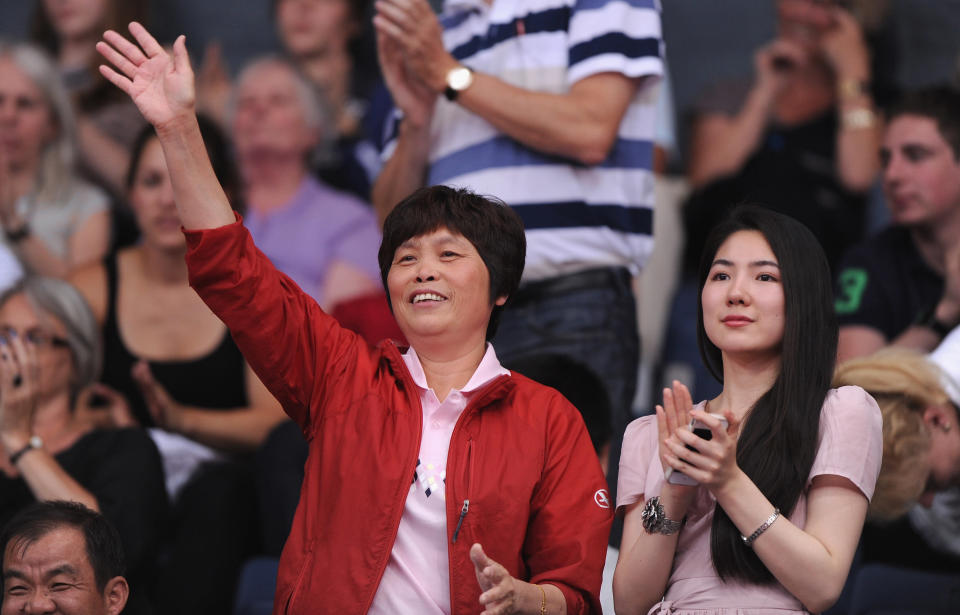 Gow Xiuyu, the mother of Lin Dan of China shows her support during his Men's Singles Badminton match against Scott Evans of Ireland on Day 3 of the London 2012 Olympic Games at Wembley Arena on July 30, 2012 in London, England. (Photo by Michael Regan/Getty Images)