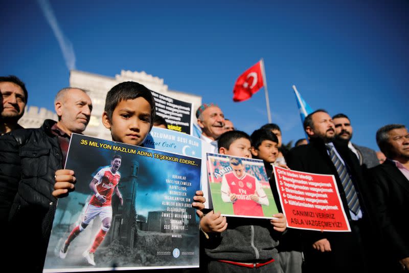 Ethnic Uighur demonstrators attend a protest against China in Istanbul